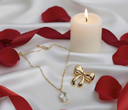 Luxury Gold Set (Set of 2): Solitaire Pendant Necklace and Elegant Bow Stud Earrings