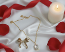 Luxury Gold Set (Set of 2): Solitaire Pendant Necklace and Elegant Bow Stud Earrings